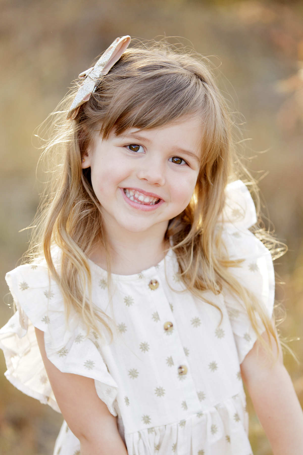 young girls standing in a field smiling