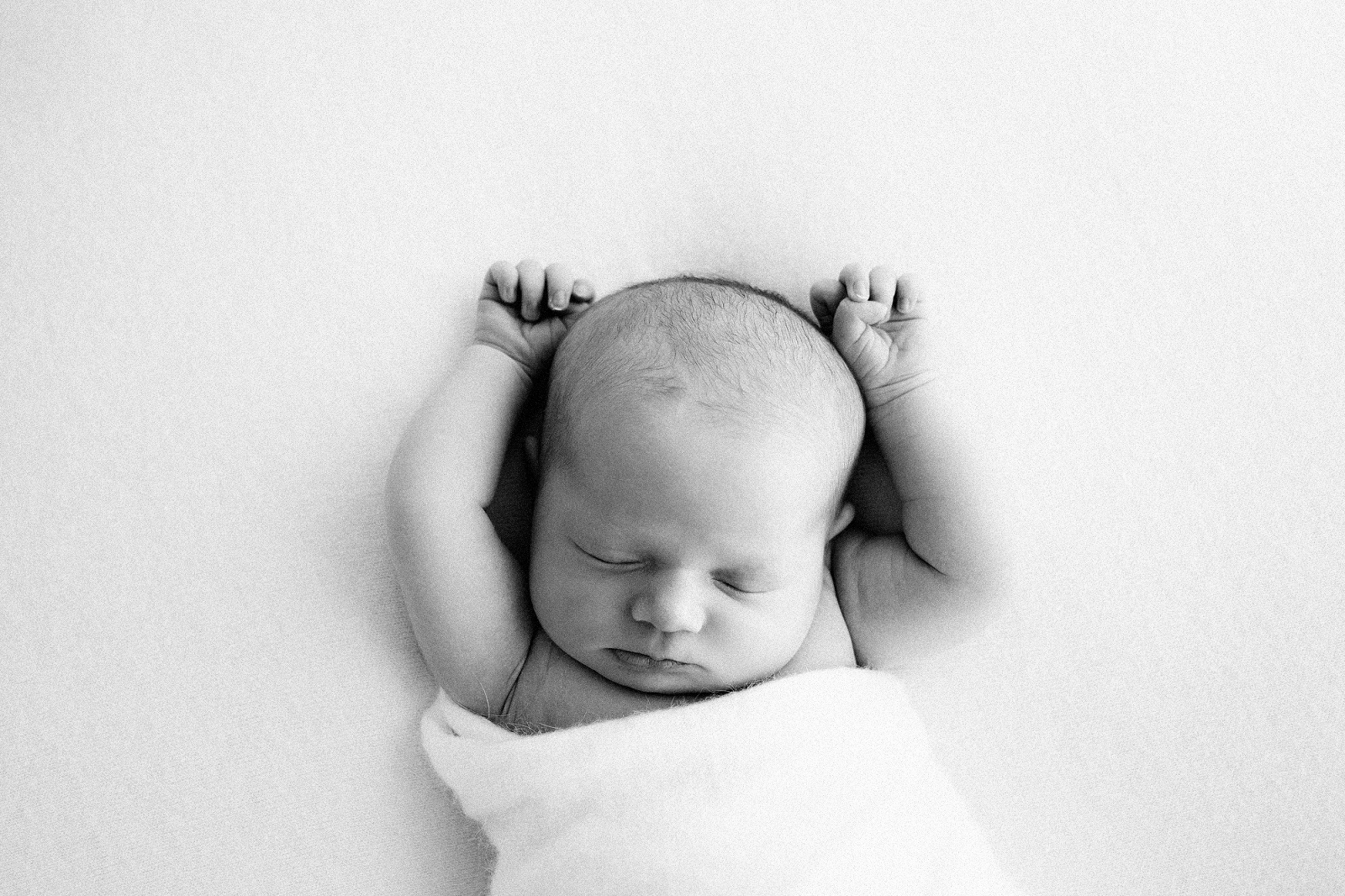 black and white image of a newborn baby